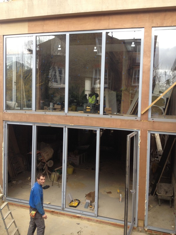 Aluminium bi-fold doors with two-storey glazing in Seven Sisters