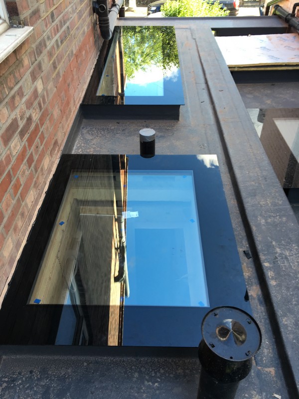 Multiple flat roof skylights on extension in Seven Sisters